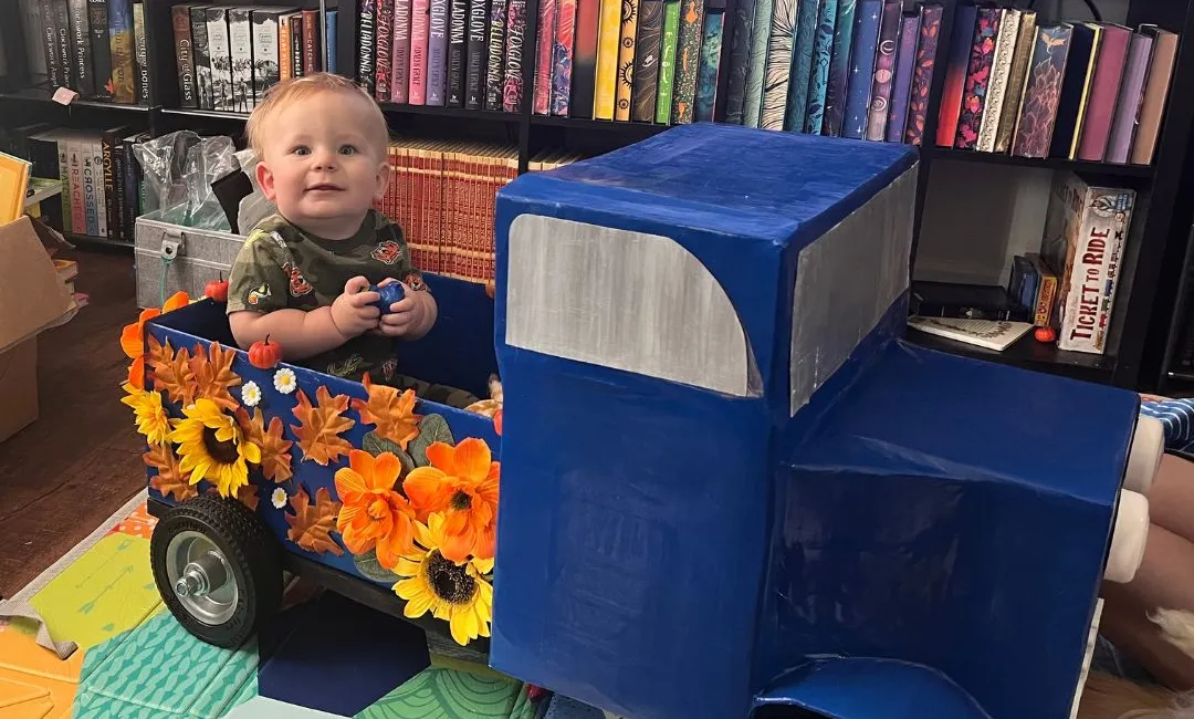 Baby in toy truck